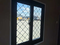 2025 rhino-cross-containers 1 deur en 3 ramen zwart 40ft hq/12 m - containerwoning / container office unit - afbeelding 35 van  35