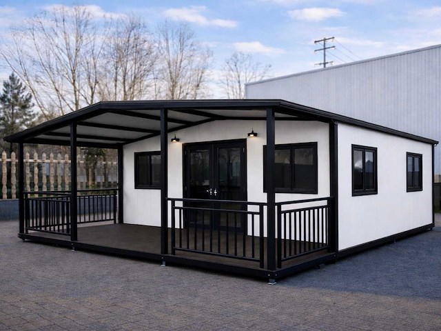 2026 rhino houses 36,5 m2 wit 2 slaapkamers, badkamer en keuken mobiele woonunit / tiny house met luifel / balkon - afbeelding 1 van  39