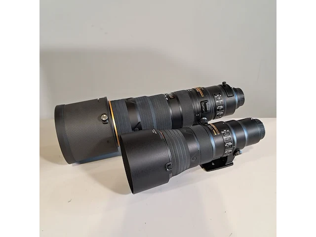 2x camera lens, nikon, o.a af-s nikkor 180-400mm 1:4e tc1.4 fl ed - afbeelding 12 van  23