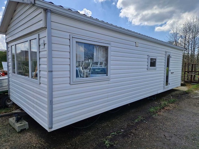 8,45x3,12x3,35 m kunststof chalet - afbeelding 1 van  18