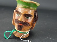 Antiek houten hoofd voor een handpop