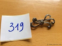 Broche ag