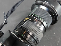 Canon a-1 spiegelreflexcamera uitgerust met een canon new fd 35-105mm f/3.5 zoomlens - afbeelding 4 van  8
