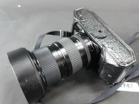 Canon a-1 spiegelreflexcamera uitgerust met een canon new fd 35-105mm f/3.5 zoomlens - afbeelding 7 van  8