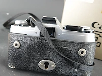 Canon ae-1 35mm analoge spiegelreflexcamera uitgerust met een canon fd 28mm f/2.8 s.c. groothoeklens - afbeelding 6 van  9