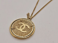 Chanel cc collier 24kt goldplated sunburst medallion pendant