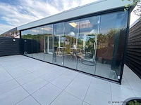 Compleet glazen schuifdeursysteem 7 deurs, veiligheidsglas 10 mm, 6540 mm breed, 7 stuks deuren 960 mm 2050 mm hoog, mat zwart ral 9005
