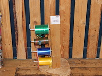 Drie rollen lint aan houten statief. - afbeelding 1 van  2