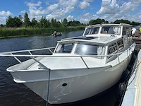 (externe locatie heerenveen ) motorkruiser ca. 9m met inboord diesel en yamaha 9,9pk - afbeelding 8 van  15