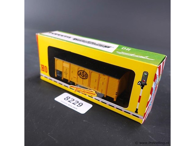 Fleischmann goederenwagen (een overdekte goederenwagen / boxcar) in gele uitvoering met het logo van het zweedse transportbedrijf asg (aktiebolaget svenska godsacentraler) - afbeelding 1 van  3