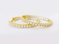 Gele exclusieve creolen volledig gezet briljanten