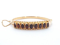 Gouden armband met rode edelstenen - afbeelding 1 van  2