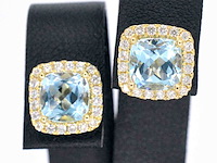 Gouden entourage oorbellen met grote topazen en diamanten