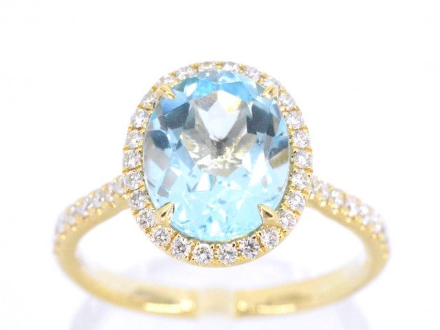 Gouden entourage ring met ovaal geslepen topaas - afbeelding 1 van  11