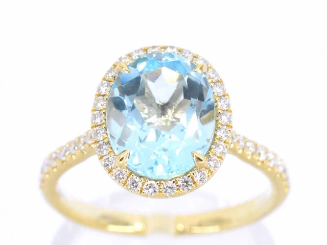 Gouden entourage ring met ovaal geslepen topaas - afbeelding 1 van  11