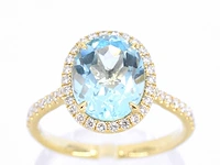 Gouden entourage ring ovale topaas