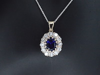 Gouden hanger met een blauwe edelsteen en natuurlijke witte diamanten - afbeelding 1 van  10