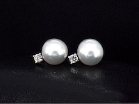 Gouden oorknoppen diamanten en zuidzee parels