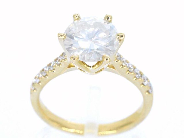 Gouden ring met een natuurlijke diamant - afbeelding 1 van  11