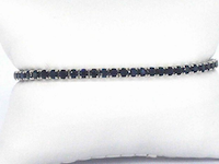 Gouden tennisarmband met 7.00ct aan blauwe saffieren