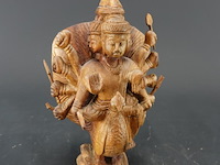 In hout meerarmige godheid of bodhisattvamet duizend handen - afbeelding 1 van  5