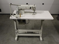 Industriele naaitafel nn. afmeting 105 x 55 cm in hoogte verstelbaar.