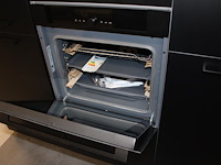 Keuken opstelling nolte met wand en eiland en luxe inbouwapparatuur - afbeelding 2 van  13