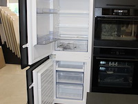 Keuken opstelling nolte met wand en eiland en luxe inbouwapparatuur - afbeelding 10 van  13