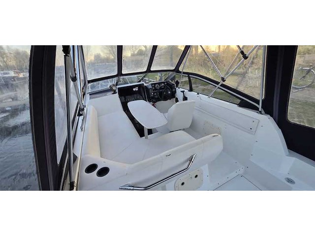 (locatie biddinghuizen) kajuitboot, bayliner, 2655, wit, 1992, met mercruiser motor - afbeelding 4 van  30