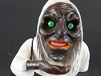 Mechanische gietijzeren spaarpot in de vorm van een heks (een zogenaamde "witch mechanical bank")