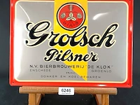 Metalen reclamebord van grolsch pilsner met de historische vermelding van bierbrouwerij de klok