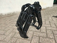 Minigraafmachine bomenklem