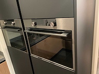 Mk memory hoekopgestelde showroomkeuken met kastenwand - afbeelding 13 van  31