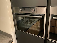 Mk memory hoekopgestelde showroomkeuken met kastenwand - afbeelding 15 van  31