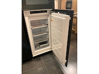 Mk memory hoekopgestelde showroomkeuken met kastenwand - afbeelding 18 van  31