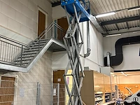 Mobiele schaarlift genie gs-2032. bouwjaar 2001. gewicht 1589 kg. gekeurd tot 2-2027. werkhoogte 790 cm onderdeel van combinatiekavel combinatiekavel van mobiele schaarlift genie en aanhanger anssems met oprijplaten. kavels m012 en m013 - afbeelding 3 van  8