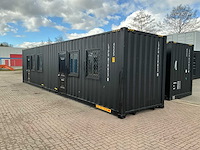 Portable home met 2 woonruimtes / 40 ft high cube - 12 meter containerwoning - afbeelding 1 van  28