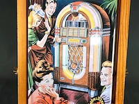Retro metalen wandbord met een afbeelding van de klassieke wurlitzer 1015 jukebox
