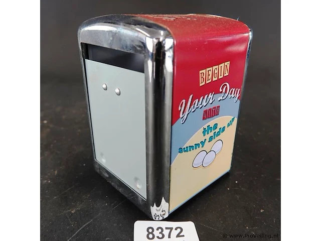 Retro servettendispenser met een jaren 50-stijl en een opdruk met eieren en de tekst "begin your day the sunny side up" - afbeelding 1 van  6
