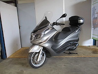 Scooters, motorscooters en motorfietsen van topmerken