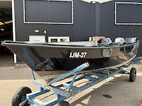 Sloep met trailer en motor