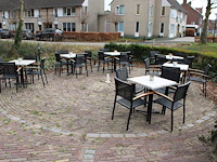 Terrasmeubilair bestaande uit zes tafels met afm. 70 x 70 cm en 24 aluminium stoelen. - afbeelding 1 van  3