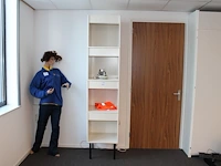 Vakkenkast opgebouwd uit vier blokken met ingebouwde verlichting. afmeting 50 x 50 cm. hoogte 230 cm
