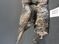 Vogel als deurklopper