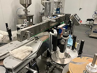 Volautomatische vul- sluit- en etiketteerlijn - afbeelding 11 van  30