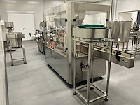 Volautomatische vul- sluit- en etiketteerlijn - afbeelding 26 van  30