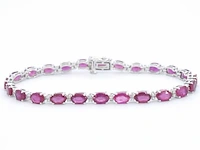 Witgouden tennisarmband met diamanten en robijn