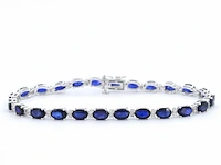 Witgouden tennisarmband met diamanten en saffier