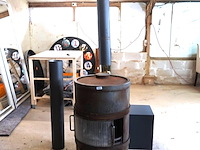 Zware ijzeren vintage harrie leenders houtkachel uit de hl serie